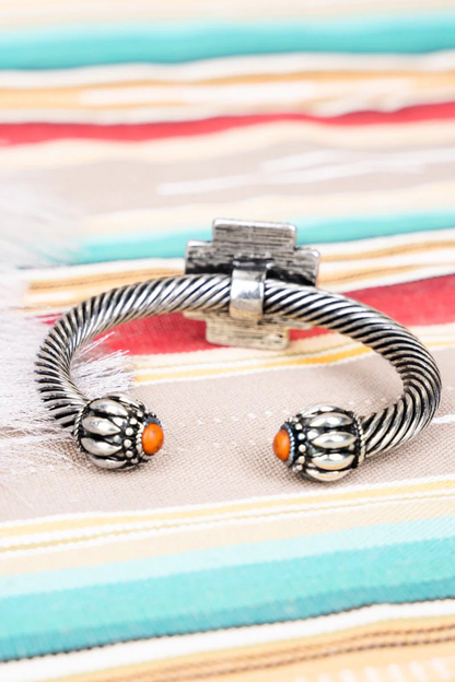 ORANGE CROSS CABLE CUFF SILVERTONE BRACELET